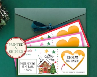 May include: A rectangular Christmas scratch-off card featuring a gingerbread house, a puppy, and a Christmas tree. The card includes the text "MERRY CHRISTMAS!", "YOU'LL ALWAYS BE MY BABY. - MAMA", and a heart-shaped scratch-off area labeled "ICE CREAM FOR DINNER!" with the instruction "SCRATCH TO REVEAL YOUR SURPRISE!" inside a dark green envelope.
