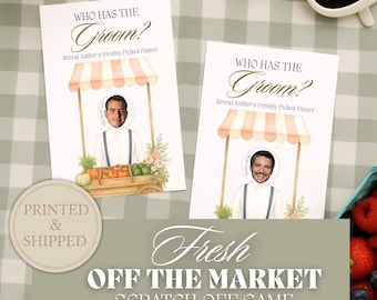 May include: Two rectangular game cards titled Who Has The Groom? Reveal Amber's Freshly Picked Fiancé. Each card features a watercolor illustration of a market stall with a striped awning and a circular cutout showing a man's face in a white shirt.
