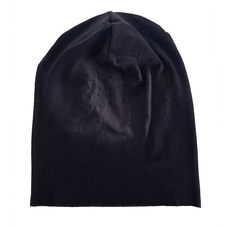 May include: A black beanie hat with a textured surface.