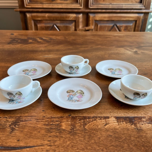 Vintage 9 piece child’s porcelain tea set - Boy Gives Girl Flowers - Japan Swan / Crane maker’s mark