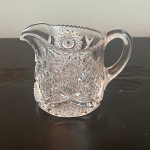EAPG 2 1/2 inches individual creamer in the Sunburst pattern by Heisey. This pattern was made from 1903 - 1920