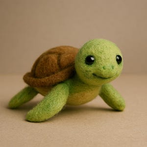 May include: A handmade felt turtle figurine. The turtle has a brown shell and a green head, legs, and body. It has two black eyes and a smiling expression. The turtle is a cute, whimsical decorative item.