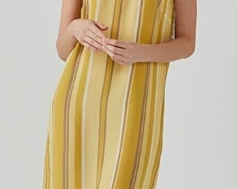May include: A yellow and white striped maxi dress with thin straps. The dress has a v-neckline and a relaxed fit.