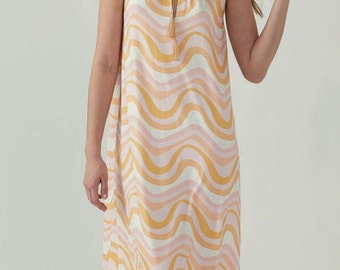 May include: A sleeveless maxi dress with a halter neckline and a wavy, abstract pattern in shades of pink, yellow, and white.