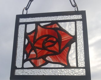 2 styles of Rose open or closed made in stained glass designed to hang in a window or in a good light.Made with the copper foil technique