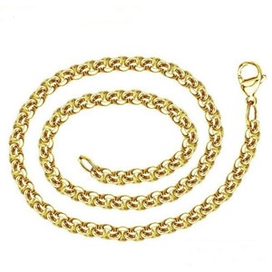 May include: A gold chain necklace with a box chain design. The chain is made of metal and has a shiny finish.