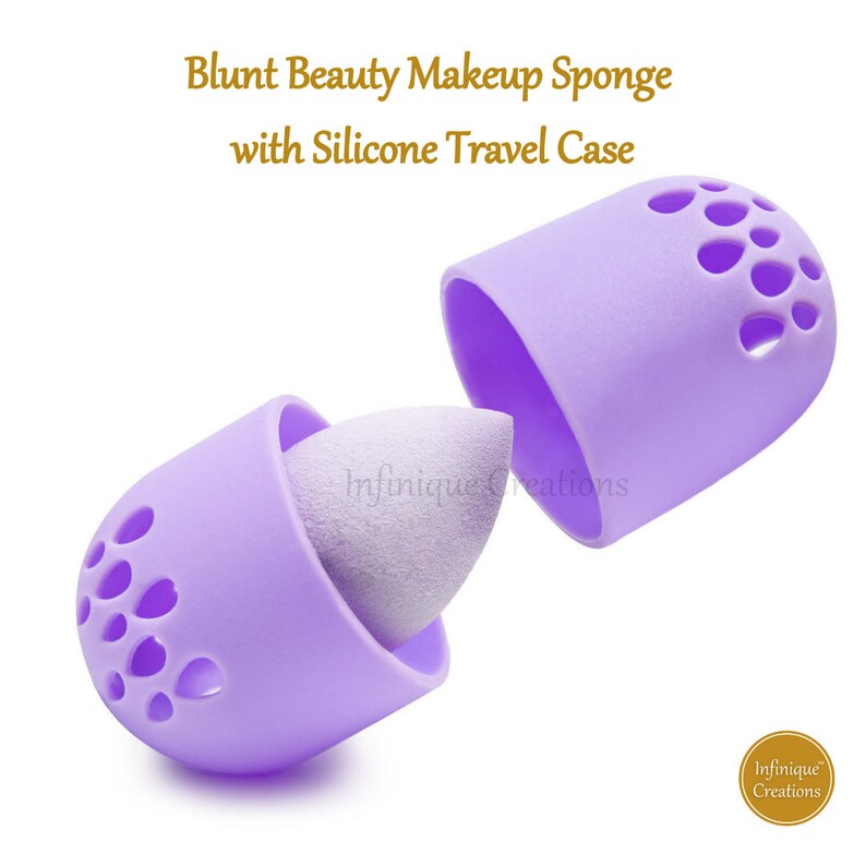 May include: Purple silicone makeup sponge holder with a white makeup sponge inside. The holder has a  pattern of small holes and is open on one side. The holder is labeled "Infinifique Creations".