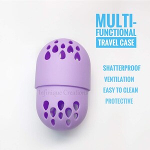 May include: Purple silicone makeup sponge holder with holes for ventilation. The holder is labeled "Infinifique Creations" and says "MULTI-FUNCTIONAL TRAVEL CASE" and "SHATTERPROOF, VENTILATION, EASY TO CLEAN, PROTECTIVE".