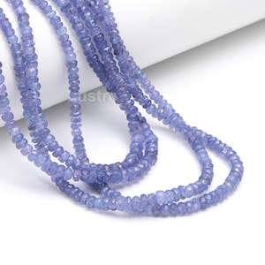 May include: A strand of light blue gemstone beads. The beads are faceted and have a slightly irregular shape. The beads are strung on a clear thread and are ready to be used for jewellery making.