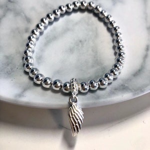 925 cuentas de plata de ley pulsera de estiramiento, pulsera de ala de ángel, joyería de ala de ángel, pulsera de encanto, regalo para ella, regalo de cumpleaños, ala de plata imagen 1