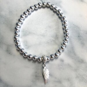 925 cuentas de plata de ley pulsera de estiramiento, pulsera de ala de ángel, joyería de ala de ángel, pulsera de encanto, regalo para ella, regalo de cumpleaños, ala de plata imagen 2