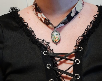 Gothic velvet choker necklace with bird cameo.