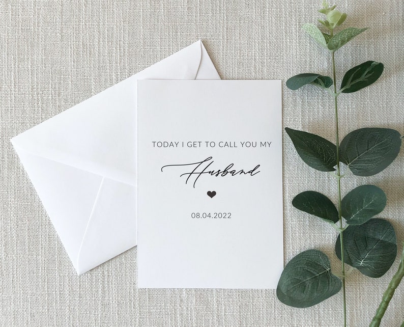 May include: A white card with black text that reads "Today I get to call you my Husband" with a small heart symbol and the date "08.04.2022".