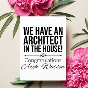 May include: A white card with black text that reads "We have an architect in the house! Congratulations Arch. Watson" surrounded by pink flowers and green leaves.
