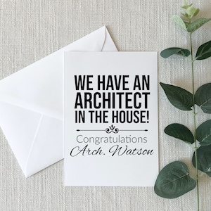 May include: A white card with black text that reads "We have an architect in the house!" and "Congratulations Arch. Watson".