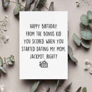 May include: A white card with black text that reads "HAPPY BIRTHDAY FROM THE BONUS KID YOU SCORED WHEN YOU STARTED DATING MY MOM. JACKPOT, RIGHT?" with a slot machine graphic below the text.