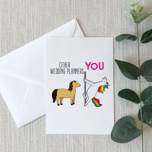 May include: A greeting card with a humorous illustration comparing wedding planners to a horse and a unicorn. The text reads "Other Wedding Planners" next to a brown horse and "You" next to a unicorn doing a pole dance.