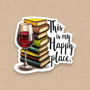 May include: A sticker featuring a wine glass filled with red wine next to a stack of books. The books are various colors, and the sticker has the text "This is my Happy place."