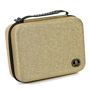 May include: Gold glitter makeup case with a black handle and a black zipper. The case has a black and gold logo that says "RB Beauty".