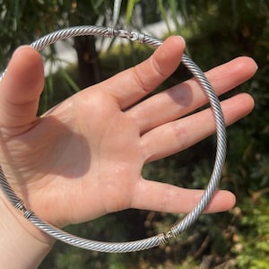Authentic David Yurman cable choker necklace in sterling silver with 14K yellow gold accents. Iconic design, excellent pre-owned condition.