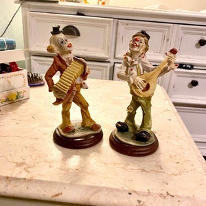 Lot of 2 Pucci clown figurines by Arnart 1984 bald hobo clowns mandolin accordion clown collectibles polka dot clown