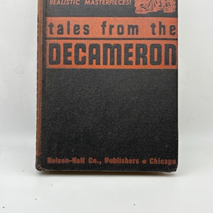 May include: A vintage book titled "Tales from the Decameron" with orange lettering on a black cover. The cover also features the text "lusty stories of love, life and adventure, realistic masterpieces!" and the publisher's name.