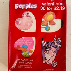 May include: A package of 30 Popples Valentine's Day cards and envelopes. The package features a red background with images of Popples characters. The text on the package reads "Forget Me Not American Greetings Valentines Popples 30 for $2.19".