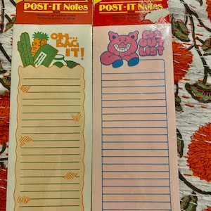 May include: Two vintage Post-it note pads. One features a grocery bag graphic with the text "OH... BAG IT!". The other is pink with a pig graphic and the text "EGG OUT LIST" and "OINK!". Both are self-stick and removable.