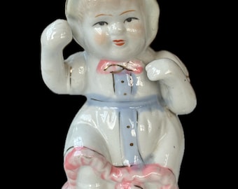 Vtg Porcelain girl figurine Victorian Face pink bow blue and gold trim baby girl ceramic figurine