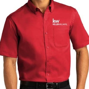 May include: A red short-sleeved button-down shirt with a white logo that says "kw KELLERWILLIAMS."