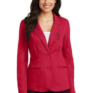 May include: A red blazer with two buttons and a pocket on each side. The blazer has a white collar and a white undershirt. The text "Your Custom Logo Here" is embroidered on the right side of the blazer.
