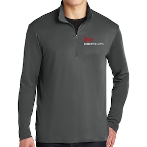 May include: A dark gray long-sleeve shirt with a red Keller Williams logo on the chest. The logo features the letters "KW" in a stylized font.