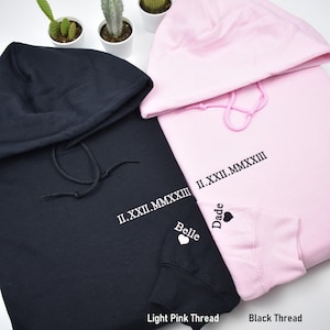 Roman Numeral custom embroidered crewneck with sleeve embroidery. Name and heart embroidered on sleeve forever in love. Light pink and black matching colors. Perfect gifts for any occasions, couples, matching outfits.