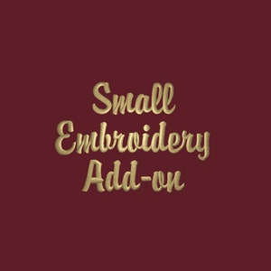 May include: Gold text on a burgundy background reads "Small Embroidery Add-on".