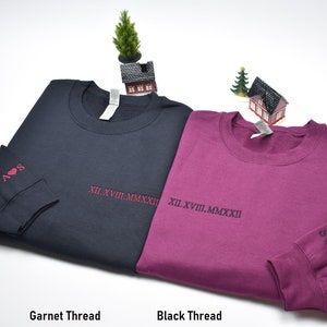 Roman Numeral custom embroidered crewneck with sleeve embroidery. Name and heart embroidered on sleeve forever in love. Garnet on Black and Black on Maroon. Perfect gifts for any occasions, couples, matching outfits.