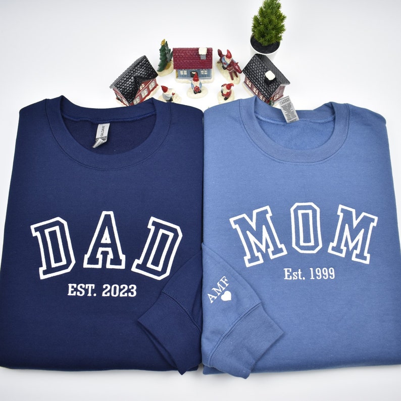 Custom embroidered sweatshirt with athletic font. mom and dad embroidered sweatshirt with custom font embroidery. White embroidery on navy and indigo blue. Perfect personalized gifts for dad, mom, grandpa, grandma, couples and loved ones.