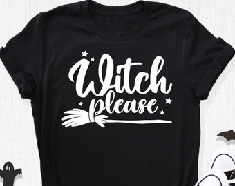 May include: Black t-shirt with the phrase "Witch please" in white script, a witch's broom, and stars. The shirt is paired with black and white sneakers. Halloween-themed decorations include bats, ghosts, and a spiderweb.