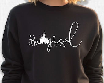May include: Black sweatshirt with a white graphic of a castle and the word "magical" with stars and a heart.