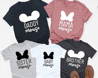 May include: Five t-shirts with different designs featuring Mickey Mouse ears, a bow, and the words "Daddy Mouse", "Mama Mouse", "Sister Mouse", "Baby Mouse", and "Brother Mouse".