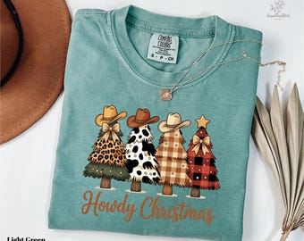 Howdy Christmas T-Shirt, Western Christmas Tree Tee, Comfort Colors , Cow Print Leopard Plaid Xmas Shirt, Rustic Cowboy Hat Holiday Gift