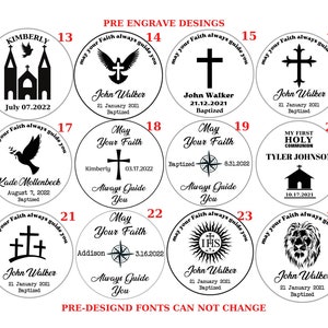 May include: A set of 24 round, black and white engraved designs for personalized gifts. The designs include religious symbols, such as crosses, doves, and a church, as well as other images, such as a compass, a lion, and a house. The text "May your Faith always guide you" is repeated on each design.