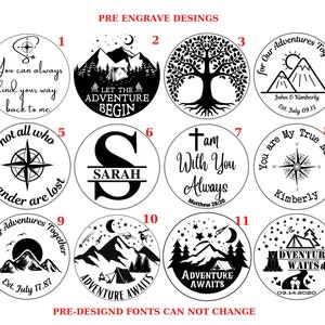 May include: Twelve black and white circular designs for engraving. Each design features a different image, including a compass, a tree, mountains, a tent, a cross, and a compass. The designs are numbered 1 through 12.