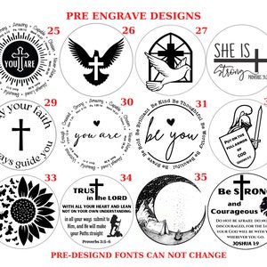 May include: A set of 12 black and white pre-designed engraving options for a round wooden disc. The designs include religious symbols, inspirational quotes, and nature-inspired imagery. The designs are numbered 25 through 36.