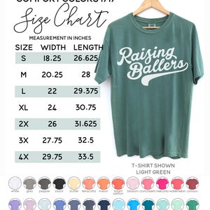 May include: Size chart for t-shirts in various sizes, with measurements in inches for width and length. The chart shows sizes S through 4X. The t-shirt shown is light green with the text "Raising Ballers" in white. The chart also shows a color palette of various colors for the t-shirts.
