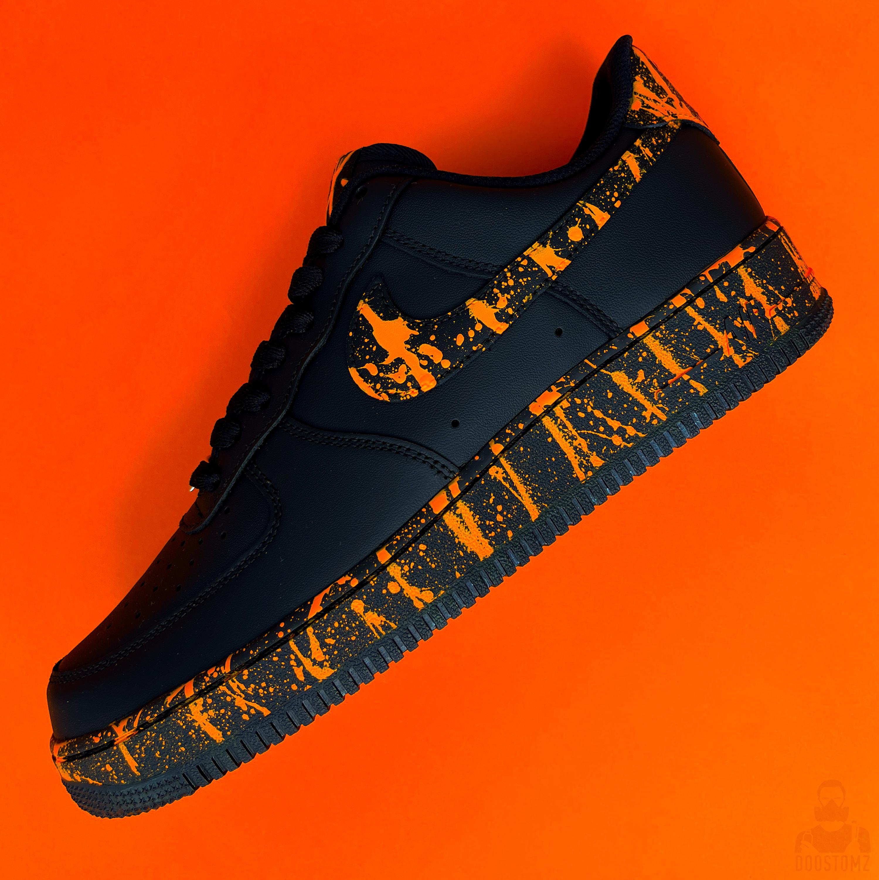 black air force 1 with paint splatter