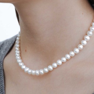 women pearl necklace on the model, 8mm round white freshwater cultured pearls with stainless steel lobster clasp