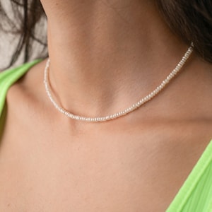 thin small tiny irregular pearl necklace choker on the model, cultured freshwater pearls