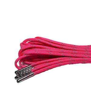 May include: A close-up of a bright pink shoelace with silver aglets. The shoelace is made of a thick, durable material and has a subtle, textured pattern.