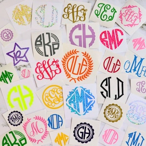 May include: Assortment of colorful monogram decals with various designs and glitter accents. The decals feature different letter combinations, including initials and full names. The decals are perfect for adding a personalized touch to laptops, water bottles, and other items.