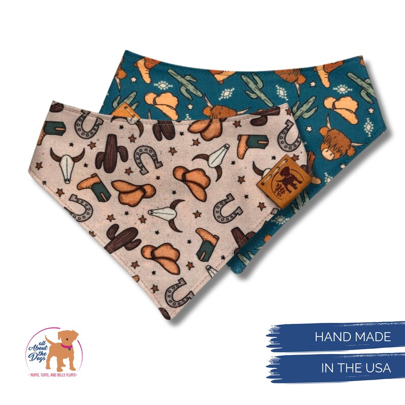 May include: Two dog bandanas with a western theme. One is beige with cowboy hats, cacti, horseshoes, and stars. The other is teal with similar western designs. Both bandanas have a leather tag. Text on the image reads "HAND MADE IN THE USA."